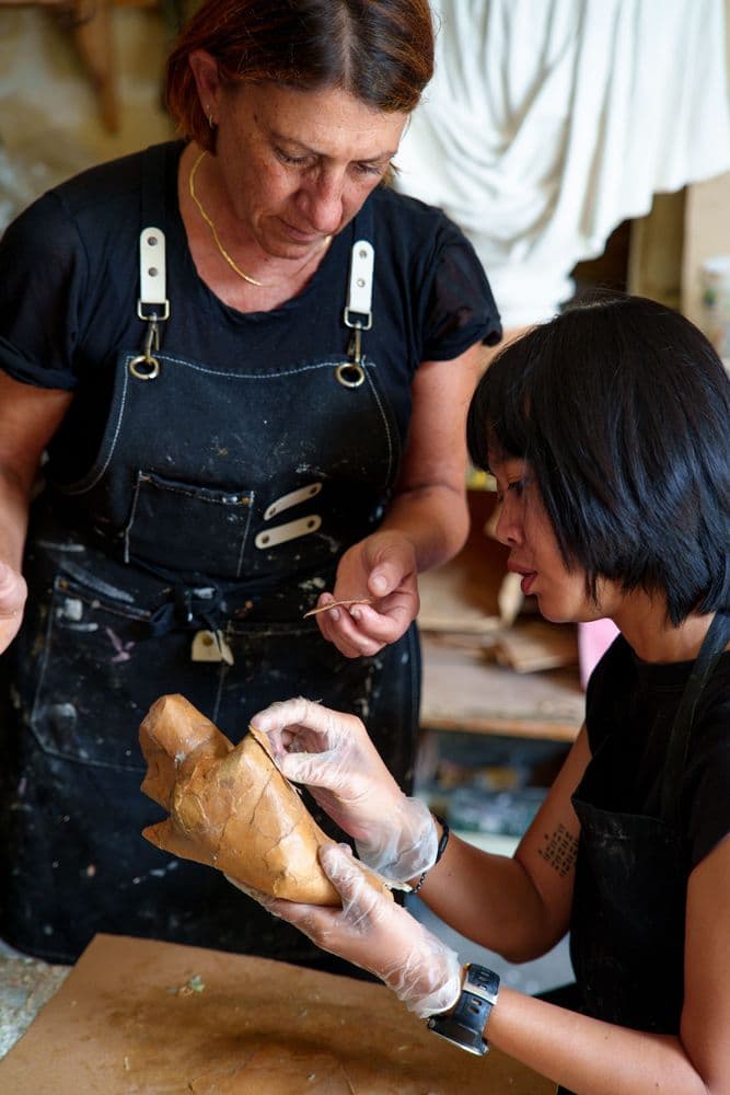 Dian Suci during her Italian residency in Lecce together with Stella Ciardo, tutor and papier-mâché artisan, 2026 | Ph. TIWI