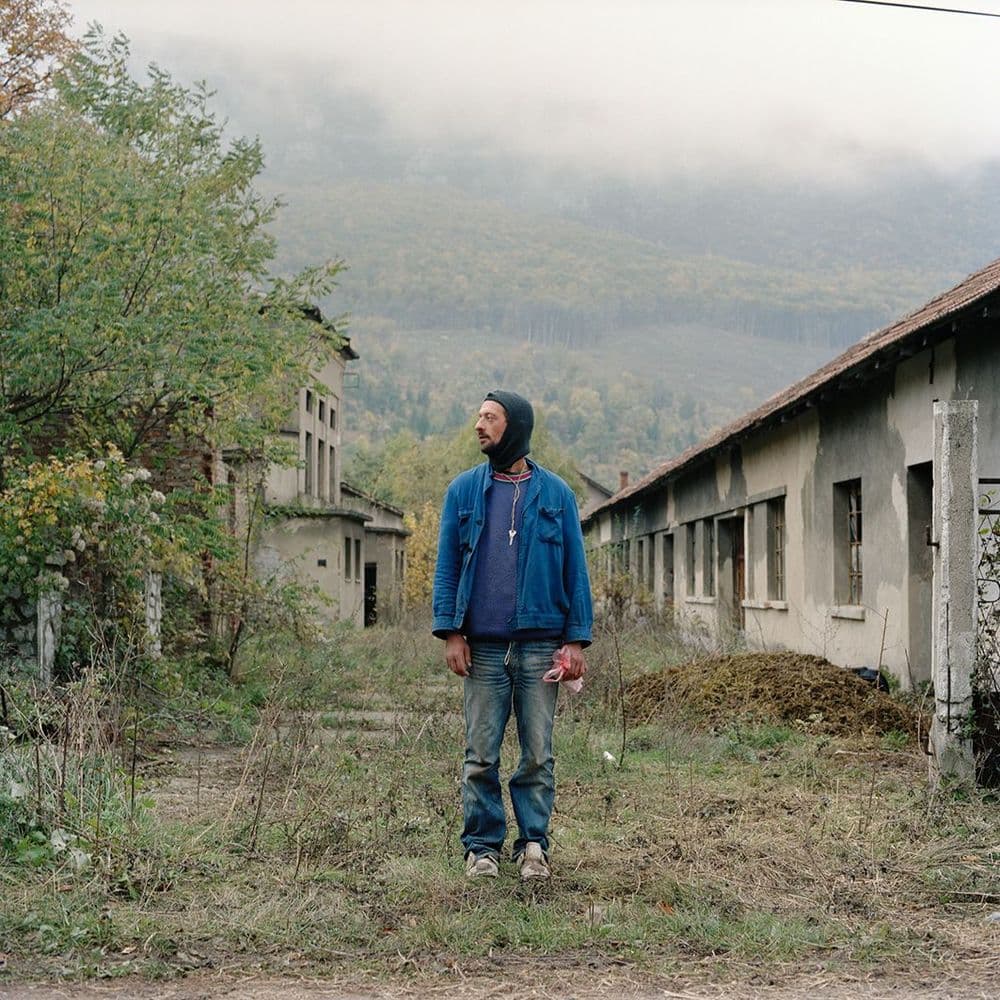 Ivor Prickett, "Thirty-seven-year-old Peda Radic is from Knin in southern Croatia but was displaced by Operation Storm in 1995. Peda lives alone in the Rtanj collective centre. His last remaining family have turned their backs on him due to his drinking problem." 2007, Rtanj, Serbia. Photography from the series “Returning Home – Croatia” © Ivor Prickett